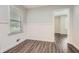 Bright room with white wainscoting, dark floors and natural light at 1105 S Parkwood Dr, Forest Park, GA 30297