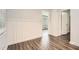 Bright room with white wainscoting, dark floors, and an open doorway at 1105 S Parkwood Dr, Forest Park, GA 30297