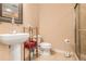 Cozy bathroom featuring a pedestal sink, toilet, glass shower, and modern fixtures at 1133 Church St # 1, Covington, GA 30014