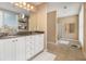 Bathroom with double vanity, granite countertops, and tiled floors, exuding elegance and functionality at 1133 Church St # 1, Covington, GA 30014