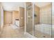 Spacious bathroom featuring a glass enclosed shower and separate tub at 1133 Church St # 1, Covington, GA 30014