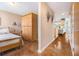 View of bedroom and its wood floors, furniture, which leads to the hallway and into the living room at 1133 Church St # 1, Covington, GA 30014