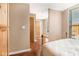 View of bedroom with natural lighting, wood floors, doors, and windows at 1133 Church St # 1, Covington, GA 30014