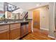 Modern kitchen featuring stainless steel appliances, wood cabinets and an open layout at 1133 Church St # 1, Covington, GA 30014