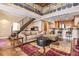 Inviting living room with high ceilings, an open floorplan, modern stairs, and a breakfast bar at 1133 Church St # 1, Covington, GA 30014