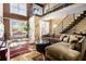 Inviting living room featuring a staircase leading to the upper level and a view of the dining area at 1133 Church St # 1, Covington, GA 30014