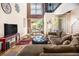 Comfortable living room featuring high ceilings, a loft, a sectional sofa, and dining area at 1133 Church St # 1, Covington, GA 30014