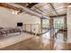 Open loft with concrete floors, wood ceiling, and a bedroom area with bed at 1133 Church St # 1, Covington, GA 30014