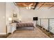 Comfortable main bedroom with ceiling fan, neutral walls, and an open-concept loft design at 1133 Church St # 1, Covington, GA 30014