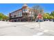 Street view of a red brick building with decorative architecture and street parking at 1133 Church St # 1, Covington, GA 30014