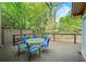 Outdoor deck with table and chairs, perfect for dining and entertaining at 3100 Queens Ne Walk, Atlanta, GA 30345