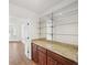 Elegant bar area featuring custom wood cabinets and granite countertop at 3100 Queens Ne Walk, Atlanta, GA 30345