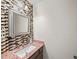 Chic powder room featuring a mosaic tile wall, granite countertop, and modern fixtures at 3100 Queens Ne Walk, Atlanta, GA 30345