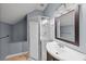 Bathroom with shower, blue walls, and vanity at 3100 Queens Ne Walk, Atlanta, GA 30345