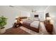 Serene main bedroom featuring hardwood floors, crown molding, and a stylish ceiling fan at 3100 Queens Ne Walk, Atlanta, GA 30345