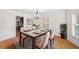 Elegant dining room featuring hardwood floors and neutral decor with a large window at 3100 Queens Ne Walk, Atlanta, GA 30345