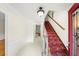 Inviting foyer with a beautiful staircase and bright, neutral decor at 3100 Queens Ne Walk, Atlanta, GA 30345