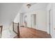 Bright hallway featuring hardwood floors, neutral walls, white trim, and natural light at 3100 Queens Ne Walk, Atlanta, GA 30345