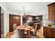 Spacious kitchen and dining area with wood cabinets, granite countertops, and stainless steel appliances at 3100 Queens Ne Walk, Atlanta, GA 30345
