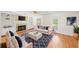 Cozy living room featuring a fireplace, built-in shelves, and comfortable seating with stylish blue accents at 3100 Queens Ne Walk, Atlanta, GA 30345