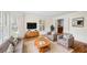 Bright living room with hardwood floors, plantation shutters, and cozy seating arrangement at 3100 Queens Ne Walk, Atlanta, GA 30345