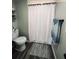 Bathroom featuring a toilet, and striped rug at 5400 Kings Camp Rd, Acworth, GA 30102