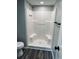 Bathroom featuring a white shower and wood-look flooring at 5400 Kings Camp Rd, Acworth, GA 30102