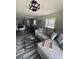 A comfortable living room with modern decor, a view of the kitchen, and plenty of seating at 5400 Kings Camp Rd, Acworth, GA 30102