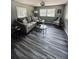 Spacious living room filled with natural light, featuring a cozy sofa and modern decor accents at 5400 Kings Camp Rd, Acworth, GA 30102