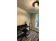 Office with a modern desk setup, light fixture, and natural lighting creating a functional space at 5400 Kings Camp Rd, Acworth, GA 30102