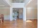Open foyer boasts hardwood floors, crown molding, and views of the staircase and living areas at 5650 Upper Creek Ct, Suwanee, GA 30024
