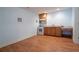 Kitchenette with wood cabinets, stainless steel oven and sink, wood floors, and neutral walls at 5650 Upper Creek Ct, Suwanee, GA 30024