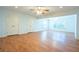Open concept living room with hardwood floors, recessed lighting, and a ceiling fan at 5650 Upper Creek Ct, Suwanee, GA 30024