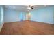 Spacious living room with hardwood floors, recessed lighting, and neutral paint at 5650 Upper Creek Ct, Suwanee, GA 30024