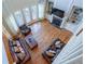 Bright, open living room with hardwood floors, fireplace, and large windows offering ample natural light at 5650 Upper Creek Ct, Suwanee, GA 30024