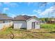 Side view of a home with white siding and a small lawn with vibrant blue skies overhead at 934 Joseph E Boone Nw Blvd, Atlanta, GA 30314