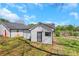 View of backyard with some grass, trees, and white siding of the house at 934 Joseph E Boone Nw Blvd, Atlanta, GA 30314