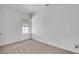 Cozy bedroom with plush carpet, neutral walls, and a window for natural light at 934 Joseph E Boone Nw Blvd, Atlanta, GA 30314