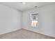 Comfortable bedroom with plush carpet, neutral walls, and a bright window at 934 Joseph E Boone Nw Blvd, Atlanta, GA 30314