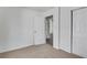 Comfortable bedroom with plush carpet, neutral walls, closet and door to other rooms at 934 Joseph E Boone Nw Blvd, Atlanta, GA 30314