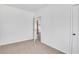 Inviting bedroom with plush carpet, neutral walls, and door to other rooms at 934 Joseph E Boone Nw Blvd, Atlanta, GA 30314