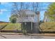 Charming two-story home with a welcoming white porch and manicured front lawn at 934 Joseph E Boone Nw Blvd, Atlanta, GA 30314