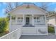 Charming front exterior with inviting porch, white brick accents, and an inviting entry at 934 Joseph E Boone Nw Blvd, Atlanta, GA 30314