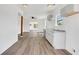 Open-concept kitchen with modern cabinets, grey countertops and light hardwood floors at 934 Joseph E Boone Nw Blvd, Atlanta, GA 30314