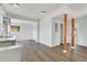 Bright, white kitchen featuring stainless steel sink and view of hardwood floors at 934 Joseph E Boone Nw Blvd, Atlanta, GA 30314