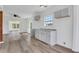Bright kitchen featuring modern white cabinets, countertops, and open access to living area at 934 Joseph E Boone Nw Blvd, Atlanta, GA 30314