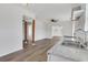 Updated kitchen featuring double sink and a view to the living area with hardwood floors at 934 Joseph E Boone Nw Blvd, Atlanta, GA 30314