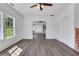 Bright living room features wood flooring, white walls, and a decorative fireplace at 934 Joseph E Boone Nw Blvd, Atlanta, GA 30314