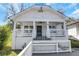 Welcoming front porch with white columns and railings offering charm and curb appeal at 934 Joseph E Boone Nw Blvd, Atlanta, GA 30314