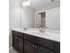 Bathroom featuring a double sink vanity with dark cabinets and large mirror at 368 Sawyer Meadow Way, Grayson, GA 30017